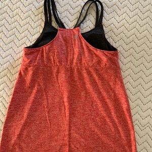 Activewear top with built in bra. Very comfortable longer length &a line style.